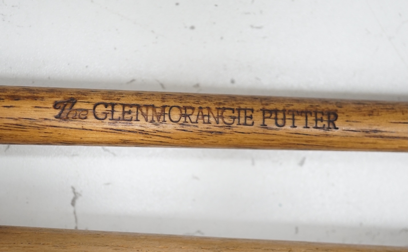 Two advertising golfing putters ‘The Glenmorangie’ handcrafted by Swilken of Saint Andrews and ‘The Laird’, handmade in Saint Andrews. Condition - good